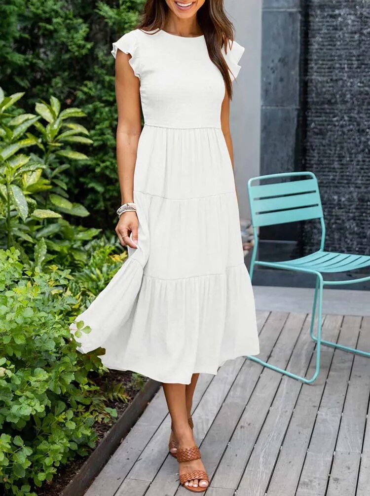 Elegantes sommerkleid: rüschendetails, taschen