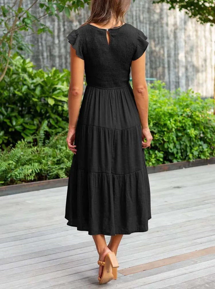 Elegantes sommerkleid: rüschendetails, taschen