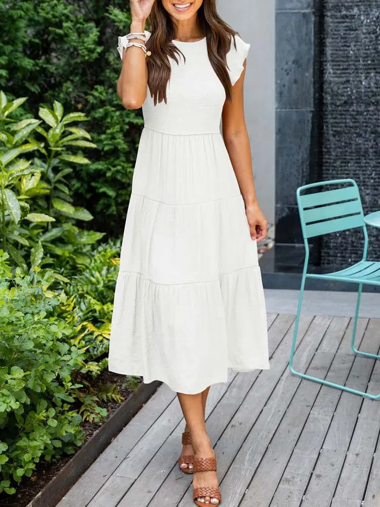 Elegantes sommerkleid: rüschendetails, taschen